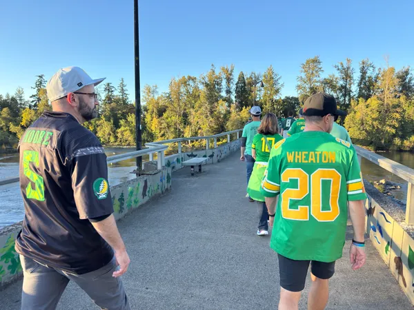 The group heads toward the game in the evening sun.