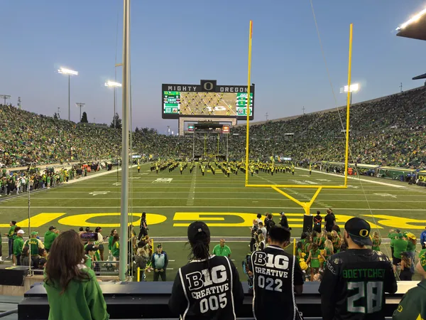 The field and crowd as evening settles over the stadium.