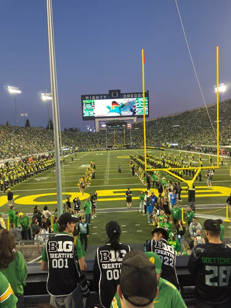 The game continues beneath the stadium lights.