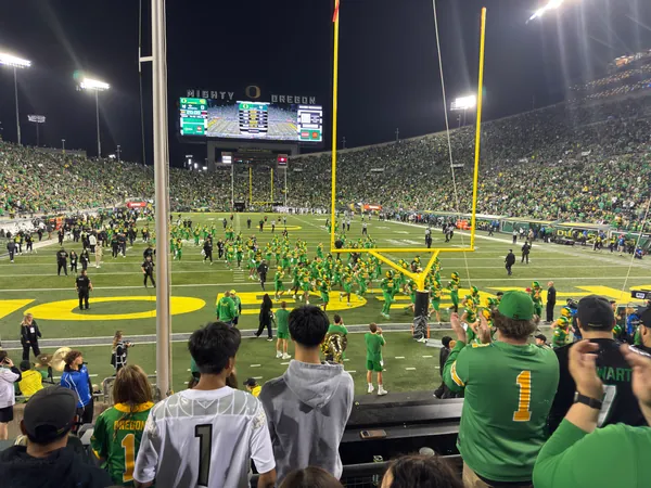 The sideline fills late in the game.