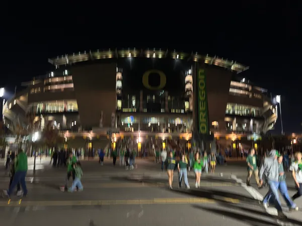 Autzen Stadium lit from outside at night.
