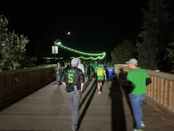 The group begins the walk back across the bridge.