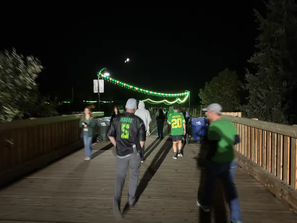 Oregon jerseys beneath the bridge lights.