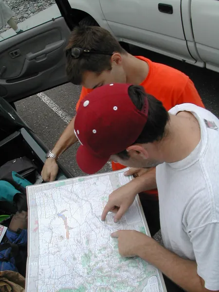 An overhead view of maps spread across the tailgate.