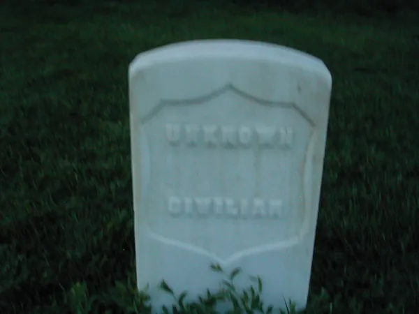 A close view of a weathered headstone.