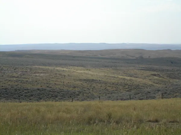 A broad stretch of plains and distant hills.