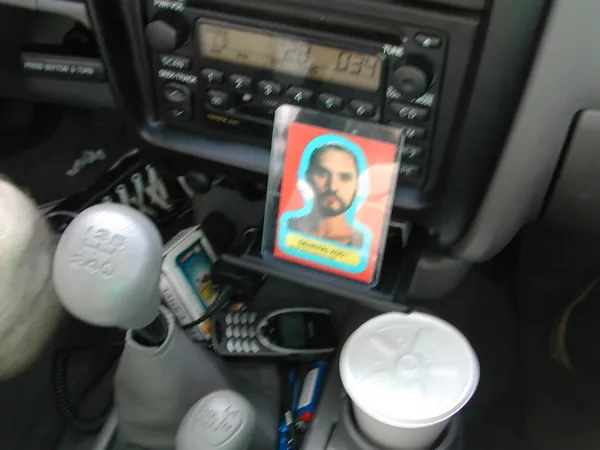 The portrait card beside drinks and the gearshift.