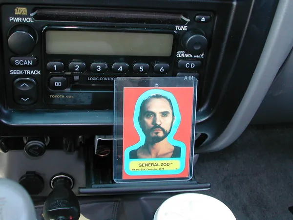 A close view of the card below the car stereo.