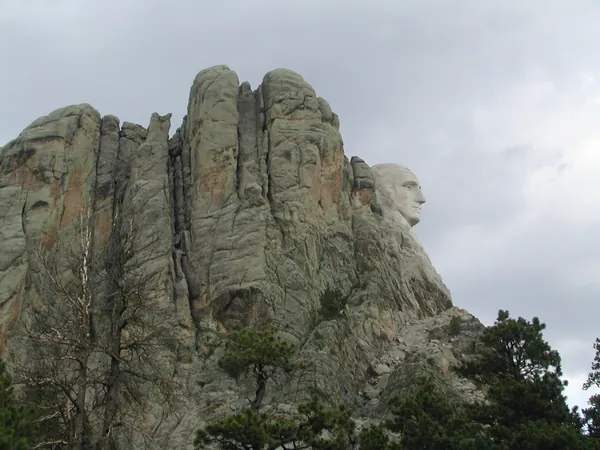 Granite formations rising above the trees.