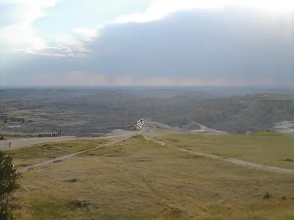 A road winding through open Badlands country.
