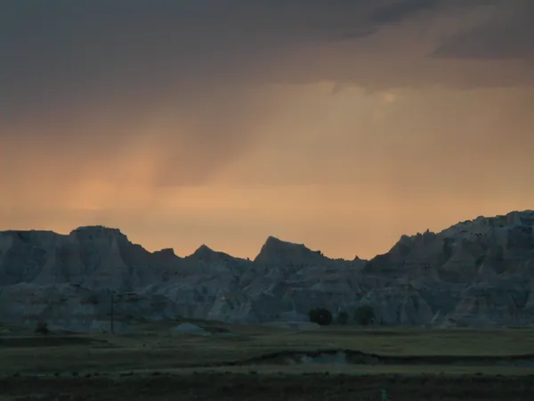 Dark ridges beneath a glowing sunset.