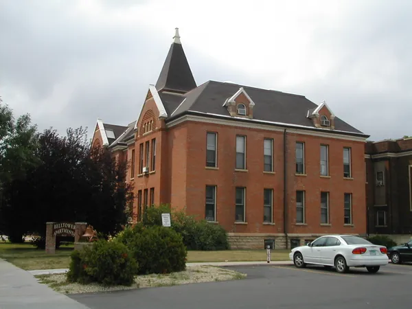 A historic brick building on a quiet street.