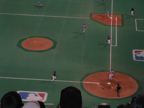 A closer view of the artificial-turf baseball diamond.