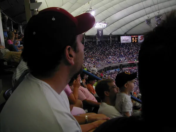 A spectator watches from the stands.