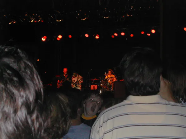 Concert lights seen over the audience.