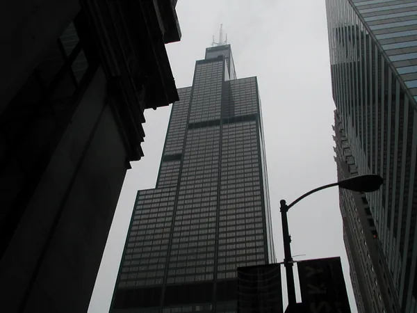 A low-angle view up the side of a skyscraper.