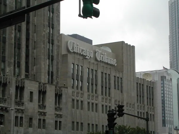 An ornate downtown building at an intersection.