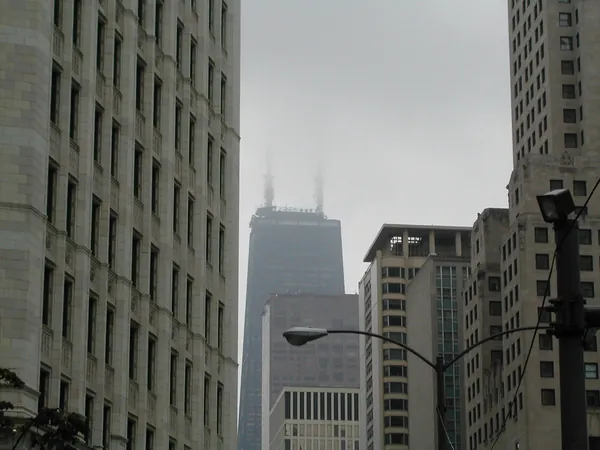 Closely packed towers against the gray sky.