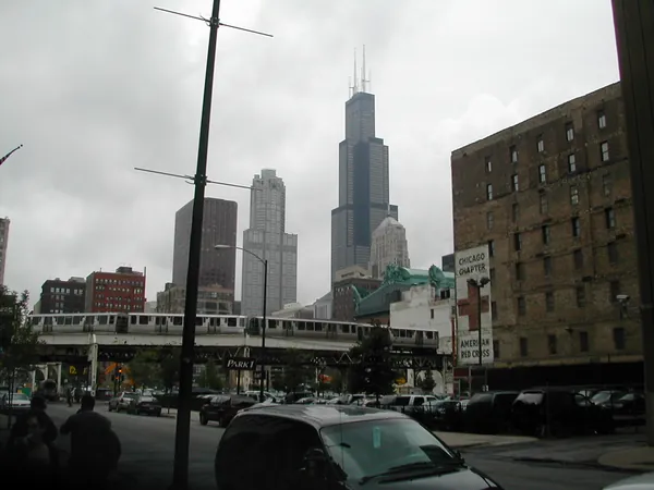 Downtown towers viewed beyond an overpass.