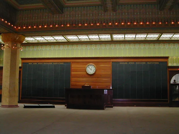 An ornate hall with a long wooden counter.