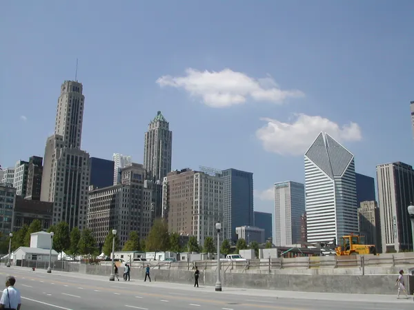 Downtown buildings viewed across a plaza.