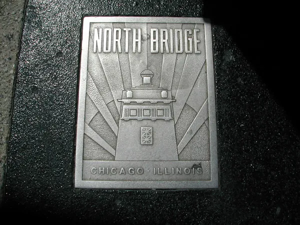A North Bridge marker set into the pavement.