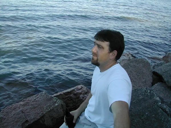 A traveler looks across Lake Michigan.