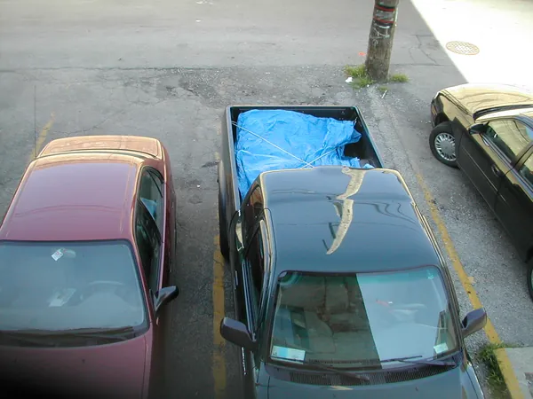 The packed pickup seen from an upper window.