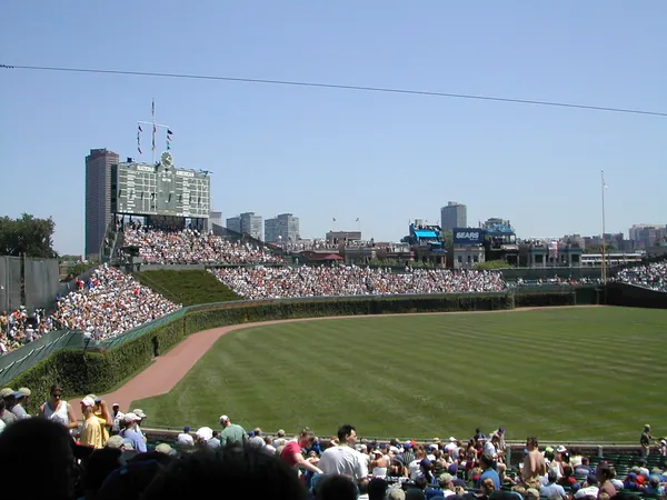 The outfield stands on a sunny afternoon.