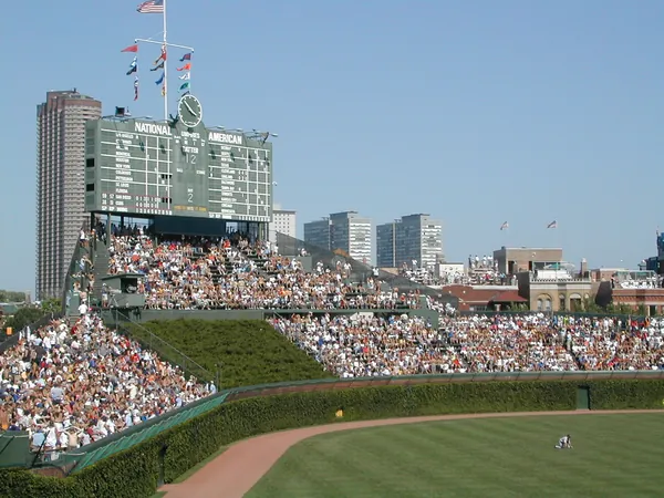 The outfield and rooftops beyond the park.