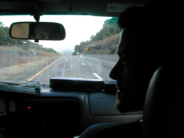 Two travelers ride in the front seats.