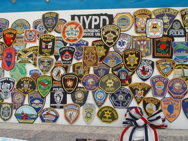 A display of police and emergency-service patches.
