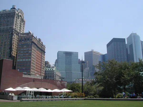 Buildings surrounding a busy city plaza.