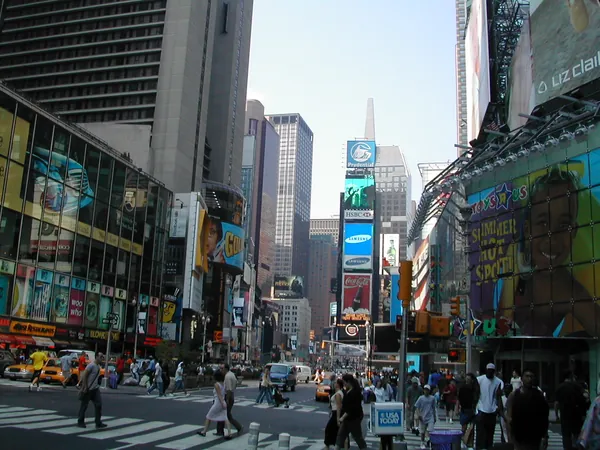 Times Square filled with signs and traffic.