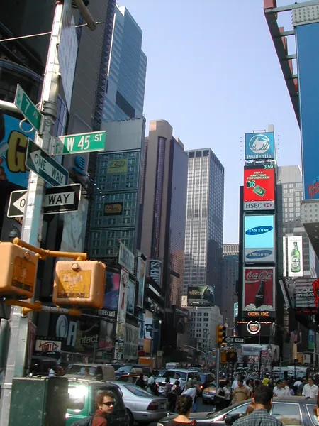 Billboards and towers above a busy intersection.
