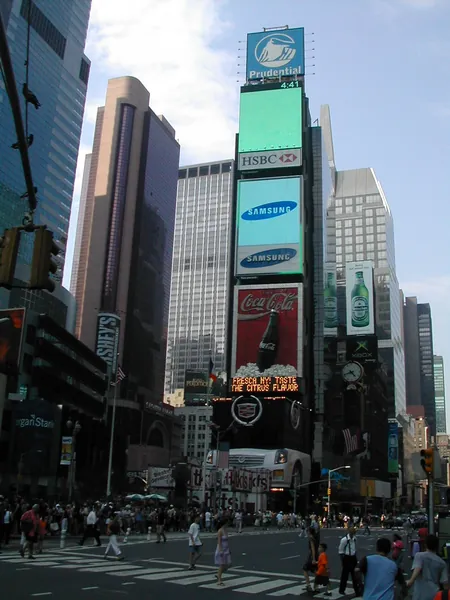 Signs and high-rises filling the avenue.