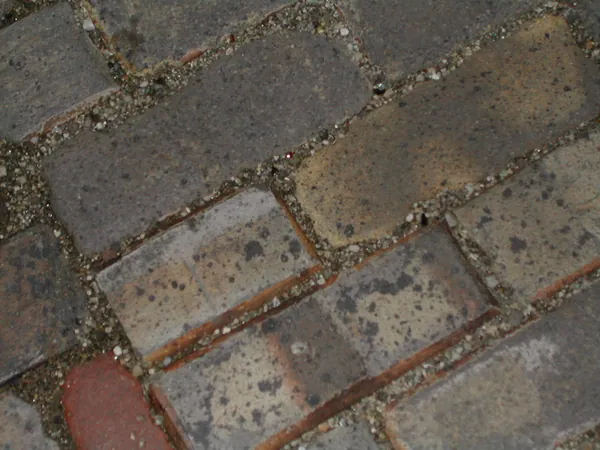 Old brick paving underfoot.