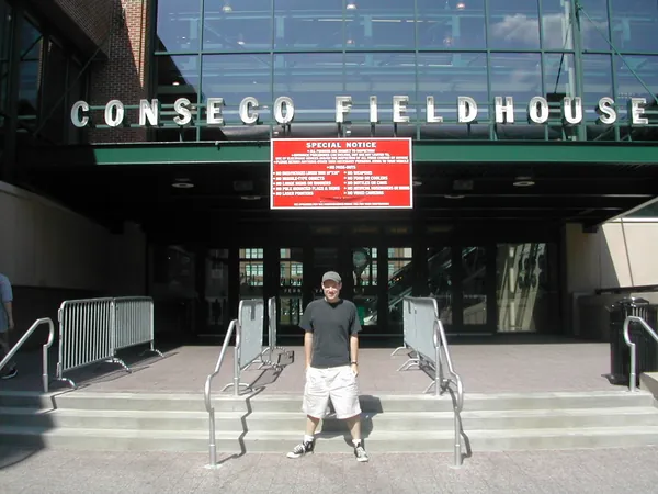Two travelers pose outside Conseco Fieldhouse.
