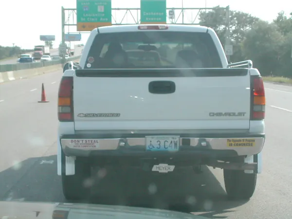 A pickup truck ahead on the highway.