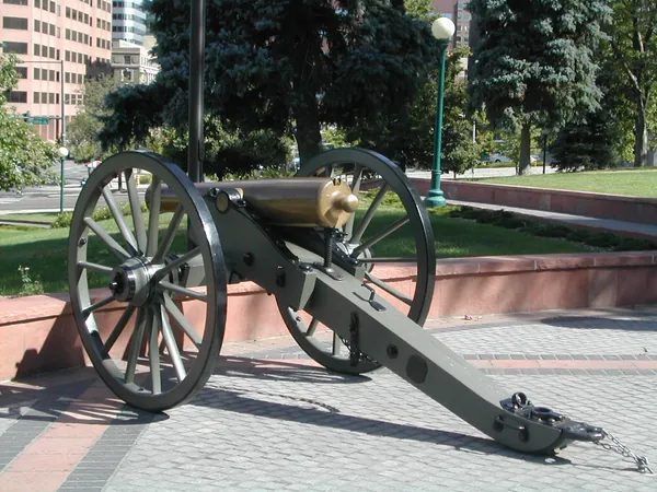 A historic cannon displayed in the plaza.